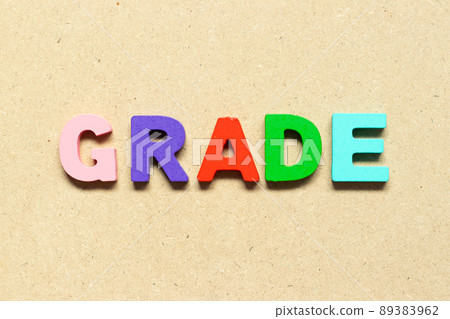 Color alphabet letter with word grade on wood background Color alphabet letter with word grade on wood background 89383962
