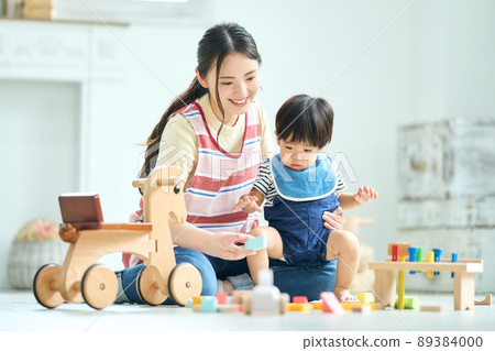 Image of a female childcare worker in her 20s Image of a female childcare worker in her 20s 89384000