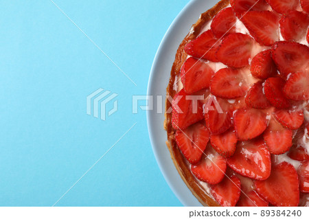 Strawberry tart on blue background, space for text Strawberry tart on blue background, space for text 89384240