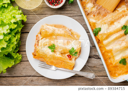 Cannelloni with filling of ground beef, tomatoes, 89384715
