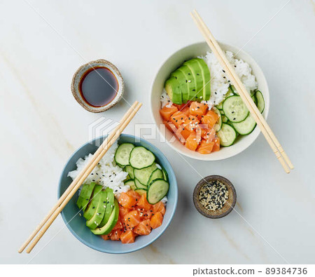 salmon poke bowl with fresh fish, rice, cucumber, avocado salmon poke bowl with fresh fish, rice, cucumber, avocado 89384736