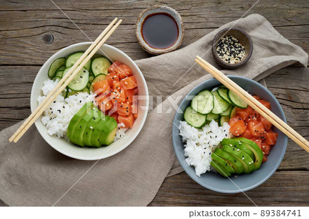 salmon poke bowl with fresh fish, rice, cucumber, avocado salmon poke bowl with fresh fish, rice, cucumber, avocado 89384741