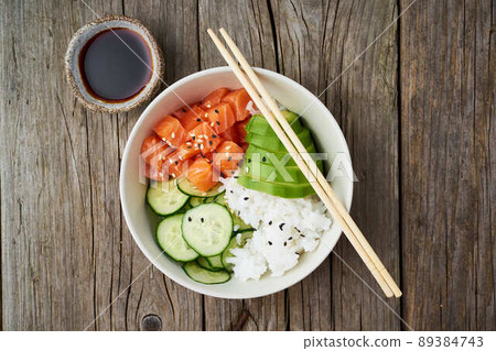 salmon poke bowl with fresh fish, rice, cucumber, avocado salmon poke bowl with fresh fish, rice, cucumber, avocado 89384743