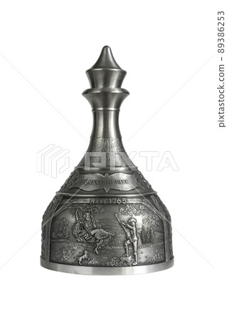 Vintage pewter decanter isolated on a white background. Photo with a shallow depth of field 89386253