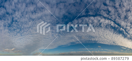 Fantastic clouds against blue sky, panorama 89387279