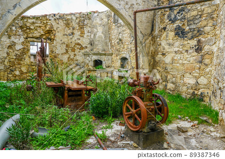 Interior of an old abandoned craft workshop with rusty workbenches Interior of an old abandoned craft workshop with rusty workbenches 89387346
