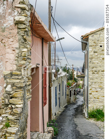 view of a romantic narrow street in a small, partially uninhabited mountain village in Cyprus 89387354