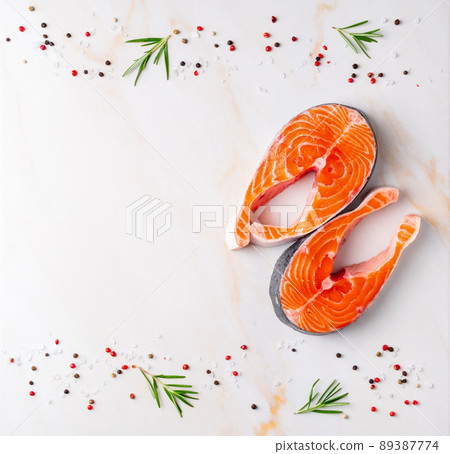 Food background, salmon steaks and seasonings Food background, salmon steaks and seasonings 89387774