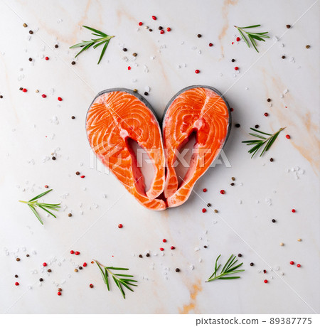 Food background, salmon steaks and seasonings Food background, salmon steaks and seasonings 89387775