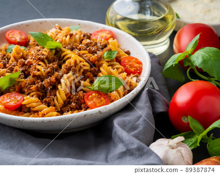 Bolognese pasta. Fusilli with tomato sauce, ground minced beef 89387874
