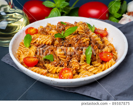 Bolognese pasta. Fusilli with tomato sauce, ground minced beef Bolognese pasta. Fusilli with tomato sauce, ground minced beef 89387875