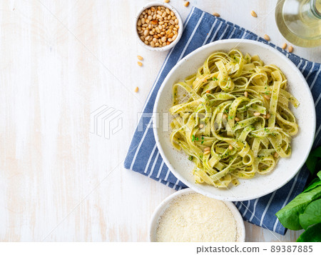 Tagliatelle pasta with pesto sauce made of Basil, garlic, pine nuts, olive oil 89387885