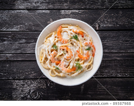 italian pasta spaghetti with shrimps, bechamel sauce and chopped dill italian pasta spaghetti with shrimps, bechamel sauce and chopped dill 89387988
