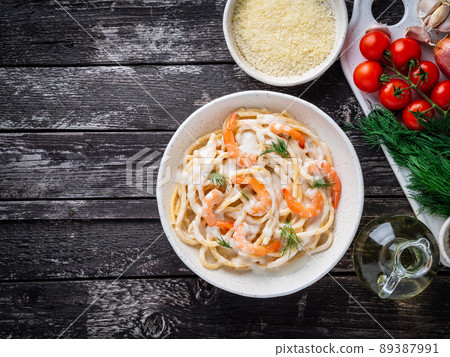 italian pasta spaghetti with shrimps, bechamel sauce and chopped dill italian pasta spaghetti with shrimps, bechamel sauce and chopped dill 89387991