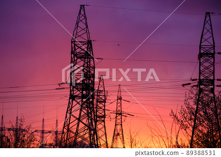 View of high voltage pole power transmission tower on sunset. Panorama high voltage tower with power lines. View of high voltage pole power transmission tower on sunset. Panorama high voltage tower with power lines. 89388531