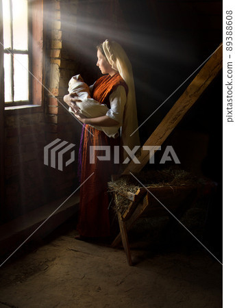 Mary in the stable near the manger with the baby Mary in the stable near the manger with the baby 89388608