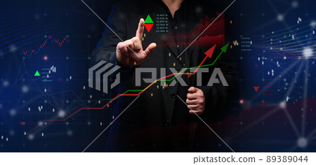Graph of price growth and indicators. Analysis of indicators on a virtual screen by a businessman in a suit. Graph of price growth and indicators. Analysis of indicators on a virtual screen by a businessman in a suit. 89389044