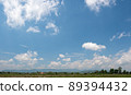 The white clouds have a strange shape and country side.Cloudy and blue sky. 89394432