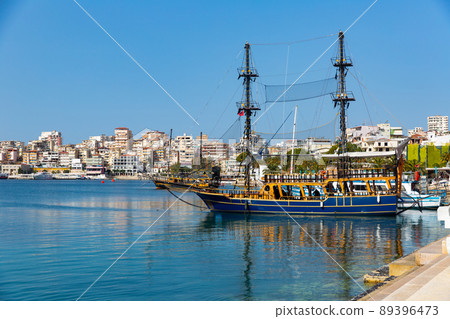 Vintage wooden sailboats moored in Sarande harbor on Ionian Sea 89396473