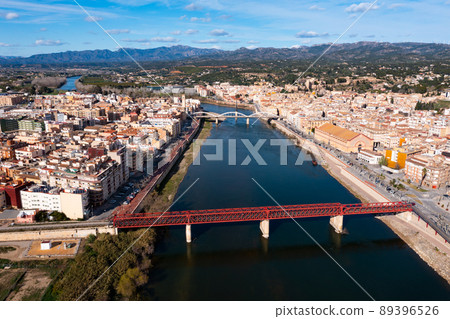 Aerial view of Tortosa on Ebro river with red railway bridge and State bridge Aerial view of Tortosa on Ebro river with red railway bridge and State bridge 89396526