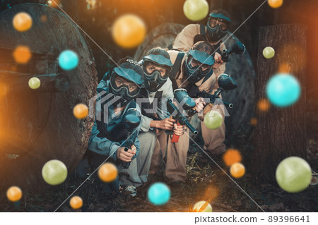 Paintball team aiming outdoors Paintball team aiming outdoors 89396641