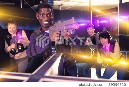Portrait of cheerful African-American with laser gun having fun 89396830