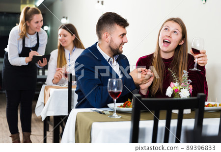 Elegant female and her boyfriend are celebrating date for dinner Elegant female and her boyfriend are celebrating date for dinner 89396833