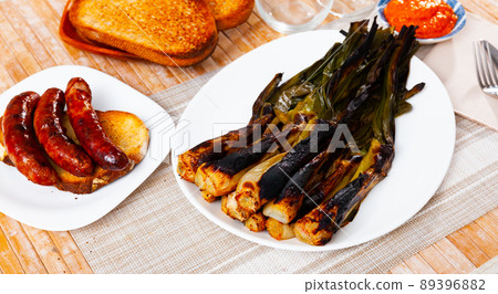 Traditional spanish foods - calsot, romesco, butifarra closeup 89396882