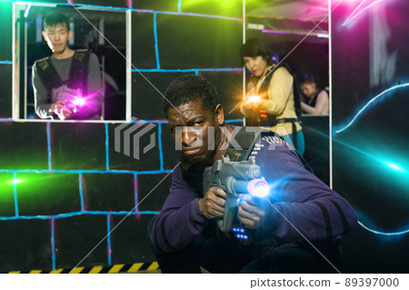 African American man playing lasertag 89397000