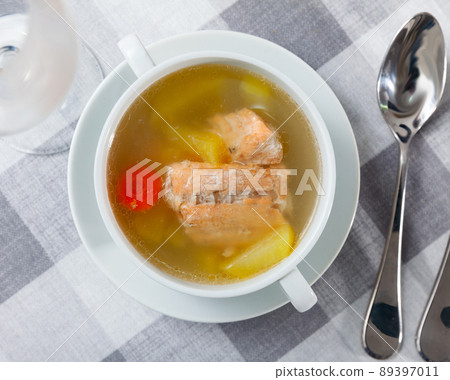 Salmon backbone soup with potatoes and carrots in white tureen Salmon backbone soup with potatoes and carrots in white tureen 89397011