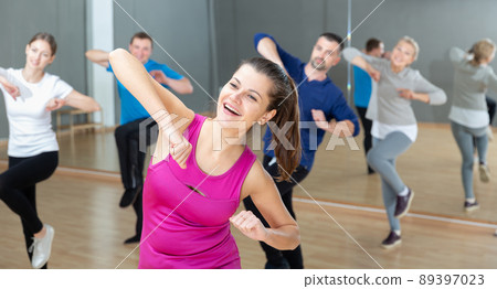 Woman training at group dance class 89397023