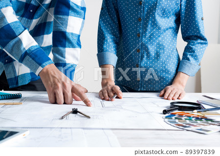 Man and woman together working at design project 89397839