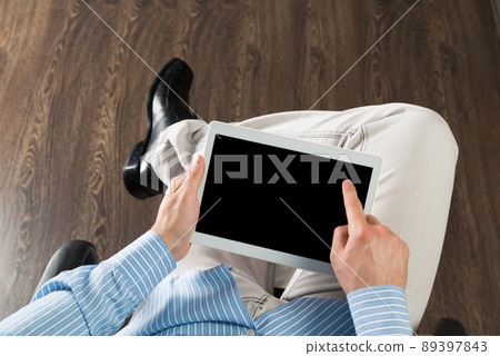 businessman with a tablet, works in the office businessman with a tablet, works in the office 89397843