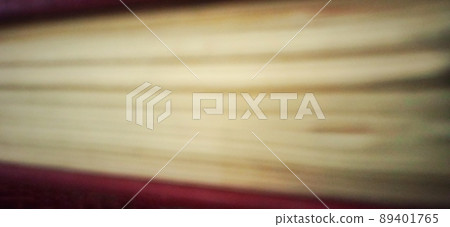 Defocused paper layers in the old book with a dim or dark background. Suitable for private and commercial advertising of library, office, campus, and school informations. 89401765