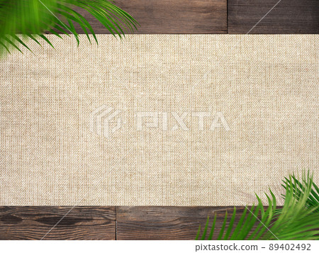 Natural background of palm leaves and wood grain 89402492