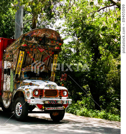 Decorated truck at the road at Karakoram highway, Pakistan Decorated truck at the road at Karakoram highway, Pakistan 89405099
