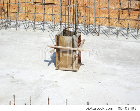 SELANGOR, MALAYSIA -JULY 7, 2021: Column stump formwork that has been installed at the construction site. Steel reinforcement bars are ready to be installed and ready to be poured concrete into it. 89405495