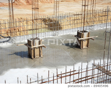SELANGOR, MALAYSIA -JULY 7, 2021: Column stump formwork that has been installed at the construction site. Steel reinforcement bars are ready to be installed and ready to be poured concrete into it. SELANGOR, MALAYSIA -JULY 7, 2021: Column stump formwork that has been installed at the construction site. Steel reinforcement bars are ready to be installed and ready to be poured concrete into it. 89405496