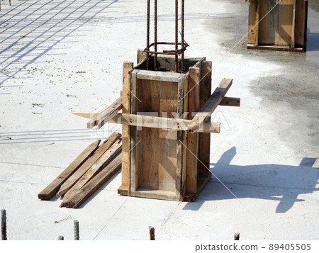 SELANGOR, MALAYSIA -JULY 7, 2021: Column stump formwork that has been installed at the construction site. Steel reinforcement bars are ready to be installed and ready to be poured concrete into it. 89405505