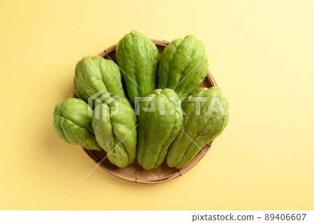 Chayote squash fruit on yellow, Organic vegetables 89406607