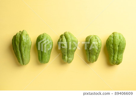 Chayote squash fruit on yellow, Organic vegetables 89406609