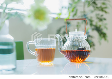 Woman drinking tea in the living room Woman drinking tea in the living room 89406640