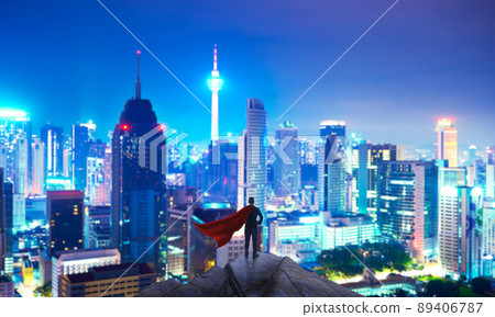 Businessman in suit and cape hero stand at top looking great cityscape Businessman in suit and cape hero stand at top looking great cityscape 89406787