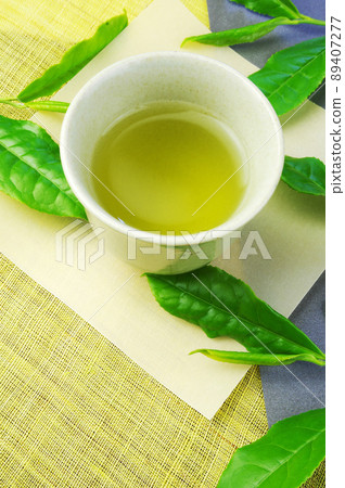 New tea and raw tea leaves New tea and raw tea leaves 89407277