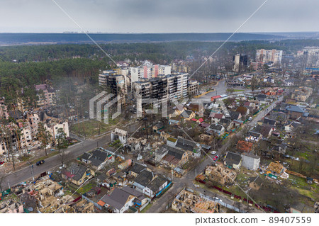 The aerial view of the destroyed and burnt buildings. The buildings were destroyed by russian rockets and mines. The Ukrainian cities after the russian occupation. The aerial view of the destroyed and burnt buildings. The buildings were destroyed by russian rockets and mines. The Ukrainian cities after the russian occupation. 89407559