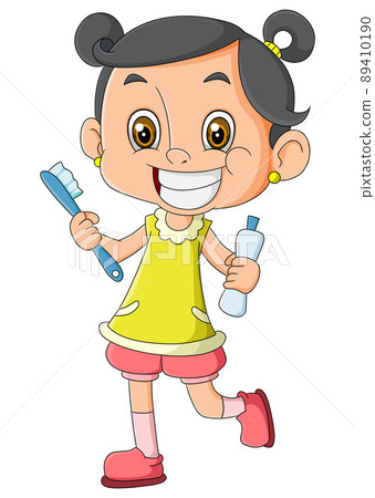 The little girl is cleaning her teeth very well and smiling 89410190
