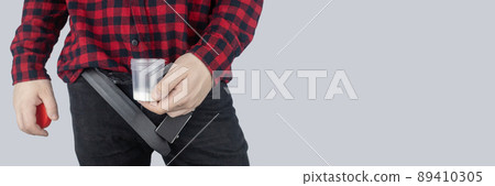 Man takes semen analysis. Spermogram. Concept. Male with his pants unbuttoned symbolizes preparation for analysis of seed for infertility, sperm motility. Suitability test for artificial insemination Man takes semen analysis. Spermogram. Concept. Male with his pants unbuttoned symbolizes preparation for analysis of seed for infertility, sperm motility. Suitability test for artificial insemination 89410305