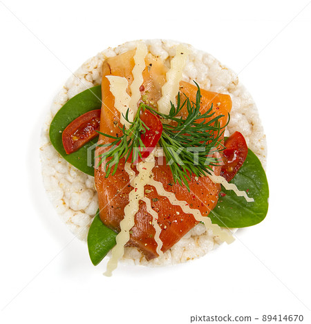 healfy food rice cake sandwich isolated on white background. Rice cakes with Basil, tomatoes, cheese and red trout or salmon fish healfy food rice cake sandwich isolated on white background. Rice cakes with Basil, tomatoes, cheese and red trout or salmon fish 89414670