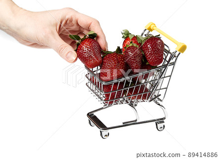 Fresh sweet Strawberries in Shopping Cart, Isolated on White Background. Close - up. organic strawberries Fresh sweet Strawberries in Shopping Cart, Isolated on White Background. Close - up. organic strawberries 89414886