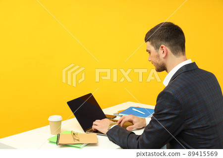 Business concept with young man working on laptop 89415569